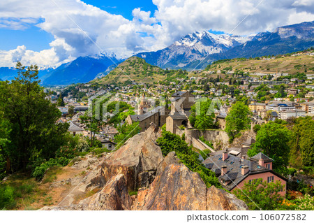 Panoramic view from a hill over City of Sion with and Swiss Alps in Canton Valais, Switzerland Panoramic view from a hill over City of Sion with and Swiss Alps in Canton Valais, Switzerland 106072582