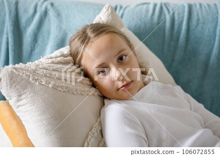 Cute child girl lying on bed at home Cute child girl lying on bed at home 106072855