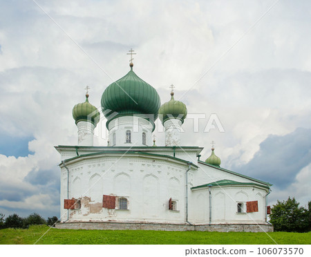 White church with green domes in old Ladoga, Russia. Old Eastern Orthodox church 106073570