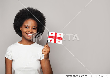 Georgian woman holding flag of Georgia Education, business, citizenship and patriotism concept 106073763
