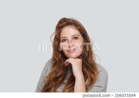 Confident woman looking at camera on white background Confident woman looking at camera on white background 106073894