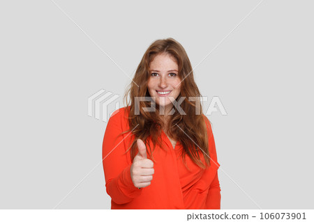 Happy woman showing thumb up on white background Happy woman showing thumb up on white background 106073901