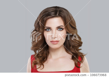 Glamorous brunette model woman with long perfect curly hair styling on white background 106073968