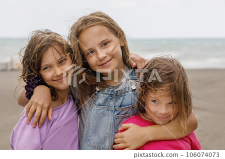 Cheerful young child girls outdoor portrait. Happy childhood, vacation and holidays 106074073