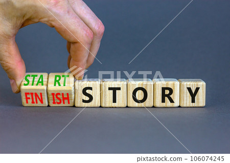 Start or finish story symbol. Concept words Start story and Finish story on wooden cubes. Beautiful grey table grey background. Businessman hand. Business start or finish story concept. Copy space 106074245