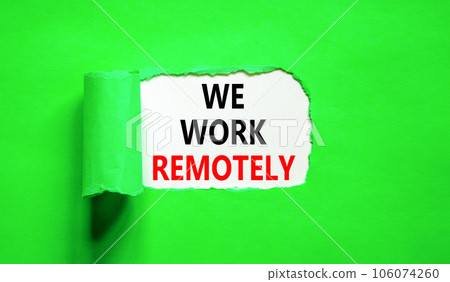 We work remotely symbol. Concept words We work remotely on beautiful white paper. Beautiful green background. Business we work remotely remote work concept. Copy space. 106074260