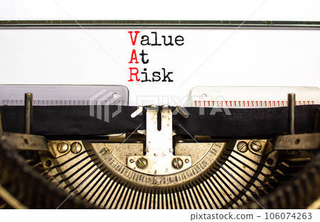 VAR Value at risk symbol. Concept words VAR Value at risk typed on beautiful retro old typewriter. Beautiful white background. Business and VAR Value at risk concept. Copy space. 106074263
