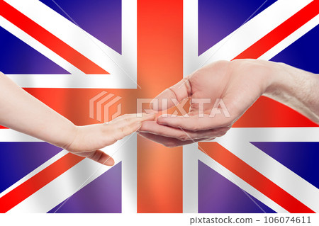 British baby and parent hands on the background of flag of England Help, aid,  charity concept 106074611