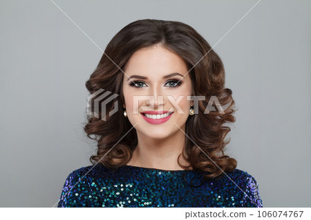 Young smiling brunette model woman with perfect wavy hair on white background 106074767
