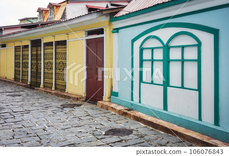 Street view of diverse architecture of Las Penas district on Santa Ana Hill in Guayaquil, Ecuador. 106076843