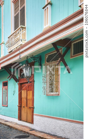 Street view of diverse architecture of Las Penas district on Santa Ana Hill in Guayaquil, Ecuador. Street view of diverse architecture of Las Penas district on Santa Ana Hill in Guayaquil, Ecuador. 106076844