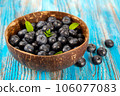 Blueberries in a wooden bowl 106077083
