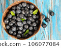Blueberries in a wooden bowl 106077084