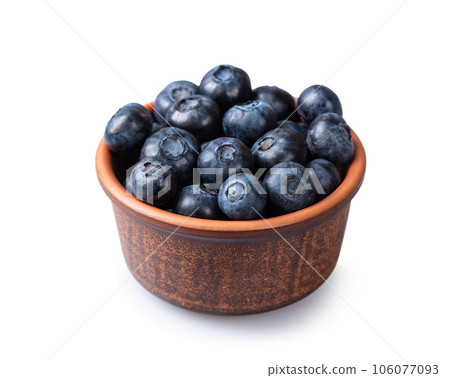 Fresh blueberries in a small brown plate Fresh blueberries in a small brown plate 106077093
