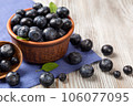 Fresh blueberries in a brown plate 106077095