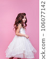 Beautiful little princess girl in white dress on pink background. Happy birthday 106077142