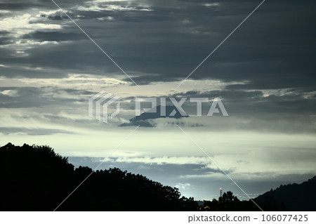 Nagasaka-cho, Hokuto City, Mt. Fuji between clouds in the moonlight 106077425