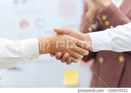 Closeup Handshake of employees after successful planning strategy marketing in the office Closeup Handshake of employees after successful planning strategy marketing in the office 106078521