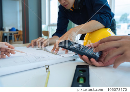 Construction and structure of Engineer or architect meeting for project working with partner and tools on model building and blueprint in working site 106078570
