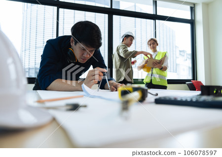 Group of engineer is discussion and brainstorming about condominium model of construction project Group of engineer is discussion and brainstorming about condominium model of construction project 106078597