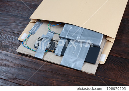Mail bomb IED - Improvised Explosive Device with c4 and cell phone module in envelope Mail bomb IED - Improvised Explosive Device with c4 and cell phone module in envelope 106079203