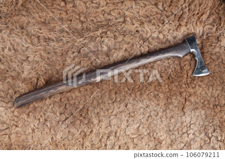 Battle axe on sheep fur Battle axe on sheep fur 106079211