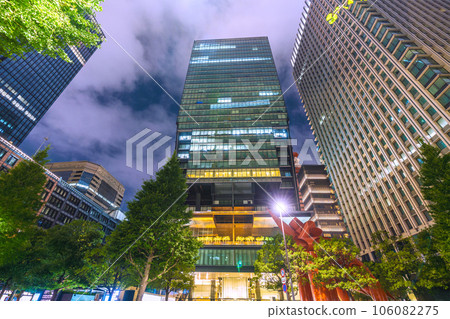 Tokyo cityscape in Japan Sultry holiday night. Business district in Otemachi, Tokyo, few people = August 19 106082275