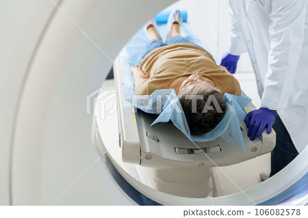 Close up of doctor and patient in the room of computed tomography at hospital. Healthcare concept 106082578