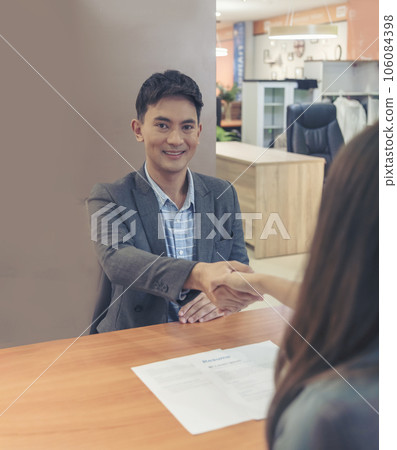 Team Business Partners shaking hands together to Greeting Start up small business in meeting room. Shakehand teamwork partners at modern office handshake together. Business mergers and acquisitions 106084398