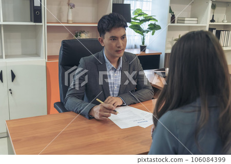 Businessman job interview by human resource HR officer interviwing, talk new employee shaking hands in office with smiling face. HR Manager interview check resume, face to face. Job Interview Concept 106084399