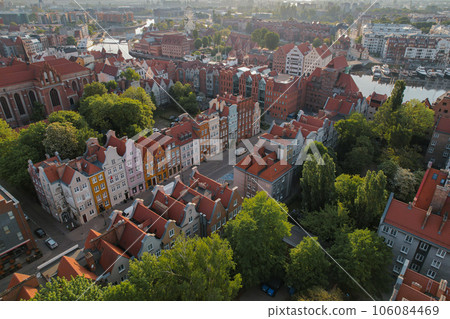 Beautiful panoramic architecture of old town in Gdansk, Poland at sunrise. Aerial view drone pov. Landscape cityscape City from Above. Small vintage historical buildings Europe Tourist Attractions 106084469