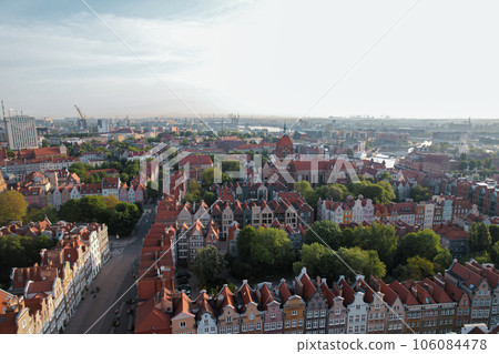 Beautiful panoramic architecture of old town in Gdansk, Poland at sunrise. Aerial view drone pov. Landscape cityscape City from Above. Small vintage historical buildings Europe Tourist Attractions 106084478