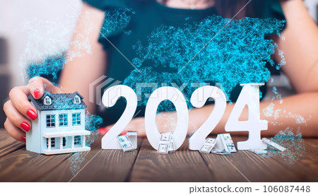 The idea of investing money in 2024, the girl chooses a house. The idea of investing money in 2024, the girl chooses a house. 106087448
