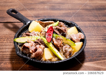 Skillet gizzard ajillo on a wooden table 106087629