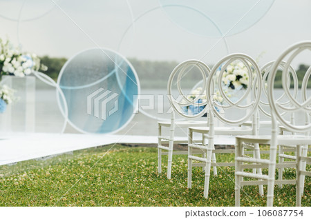 Place for wedding ceremony on river beach outdoors. Large installation of round arch 106087754