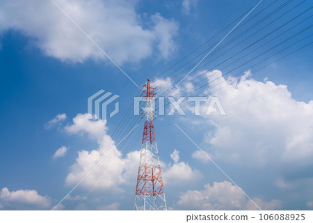 Blue sky and red and white transmission tower 106088925