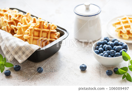 Freshly baked waffles with fresh  blueberries 106089497