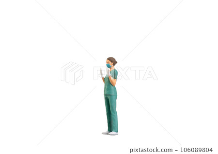 Miniature people young doctor in scrubs Isolated on white background with clipping path 106089804
