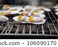 Butter-grilled scallops on the barbecue 106090170