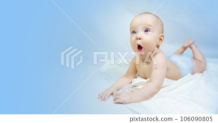 a baby with a hemangioma on his neck lies on a blue background 106090805