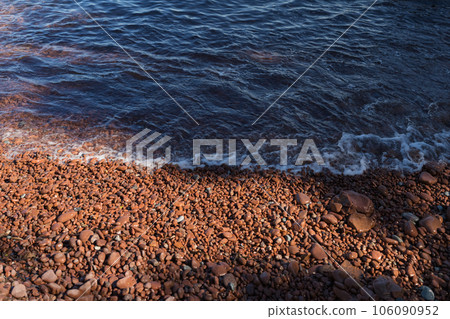 French Riviera beach with red pebbles French Riviera beach with red pebbles 106090952