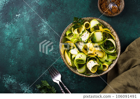 Raw sliced zucchini vegan pasta or salad. 106091491
