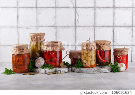 Pickled vegetables in glass jars. Pickled vegetables in glass jars. 106091624
