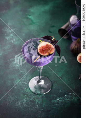 Purple fig cocktail or mocktail in glass Purple fig cocktail or mocktail in glass 106091629