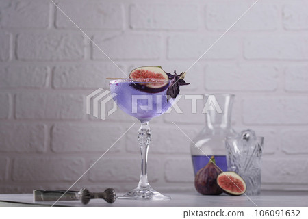 Purple fig cocktail or mocktail in glass Purple fig cocktail or mocktail in glass 106091632