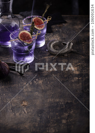 Purple fig cocktail or mocktail in glass Purple fig cocktail or mocktail in glass 106091634