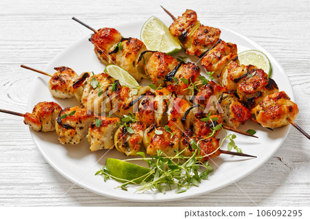 chicken souvlaki with thyme and lime on plate 106092295