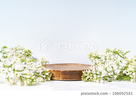 Cosmetics skin care product presentation stage display made with wooden podium and blossom branch on white background. 106092581