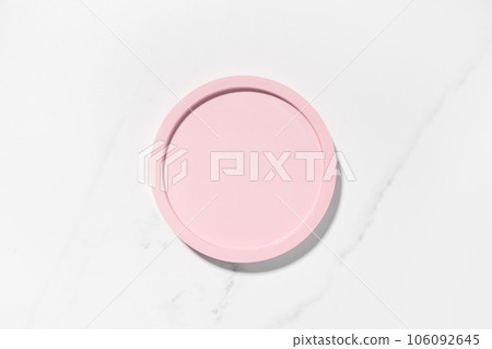 Beauty cosmetics product presentation flat lay mockup scene with pink circle shape on white marble table with copy space. Trendy sunlight,  top view. Studio photography. 106092645
