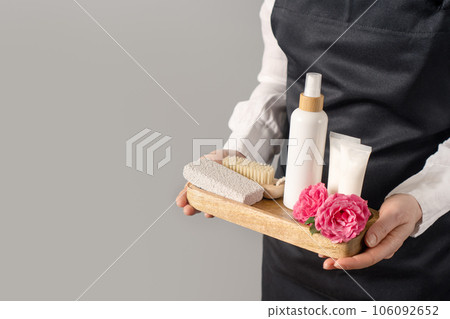Tray with spa supplies in woman's hands, copy space 106092652
